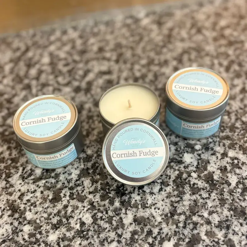 Cornish Fudge soy candle tins on a Cornish granite worktop